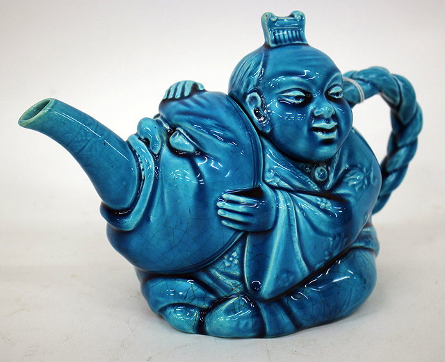 Appraisal: A VICTORIAN MINTON MAJOLICA TEA POT with blue glaze and