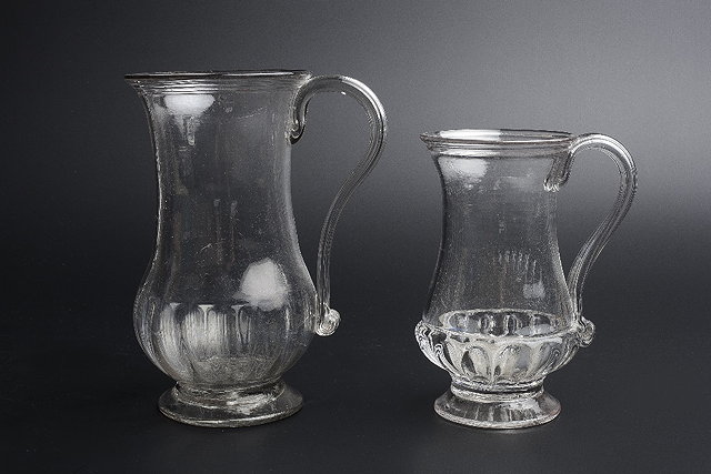 Appraisal: AN TH CENTURY GLASS BALUSTER MUG with lobed lower body