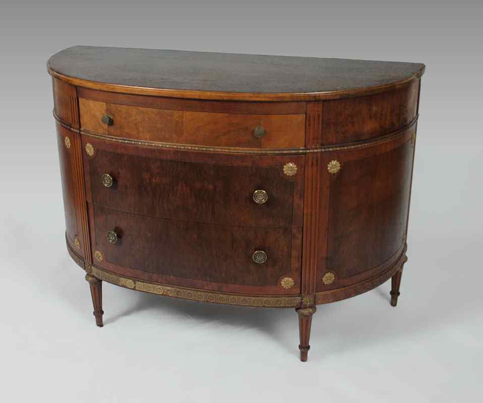 Appraisal: DEMILUNE DRAWER COMMODE Half round over drawer with veneered panels