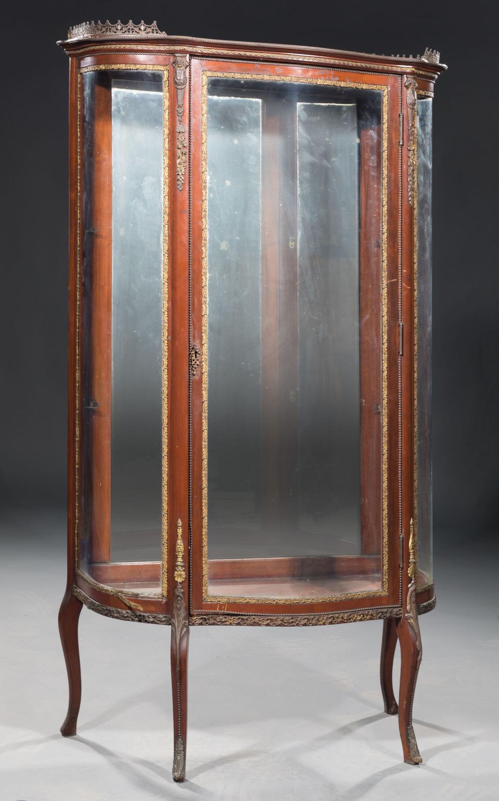 Appraisal: Louis XVI-Style Bronze-Mounted Vitrine galleried top caryatid mounts serpentine case