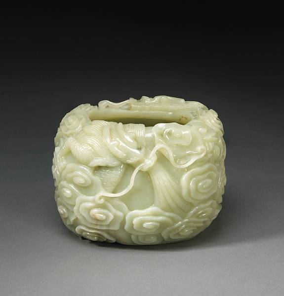 Appraisal: A pale greenish white hardstone bowl with dragon and cloud