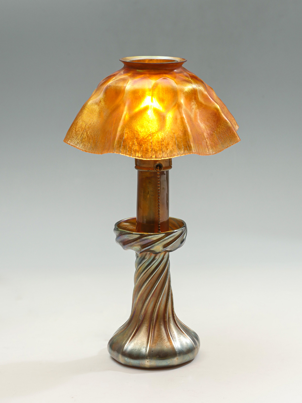 Appraisal: TIFFANY FAVRILLE GLASS CANDLE STICK LAMP WITH SHADE Golden ribbed