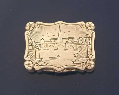 Appraisal: A Victorian engraved vinaigrette with a five arched bridge over