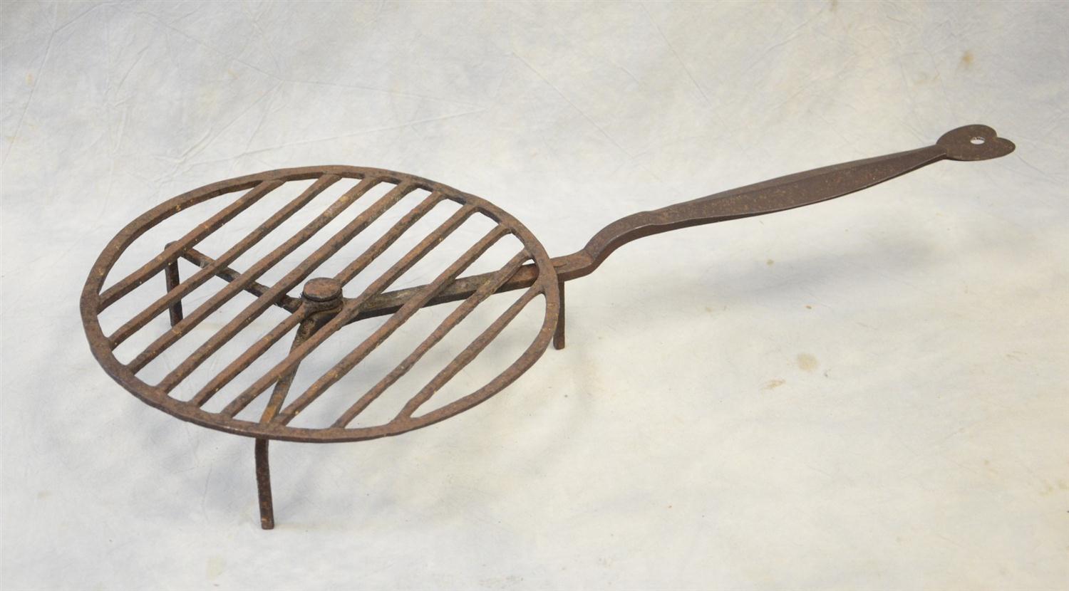 Appraisal: Wrought iron rotating fireplace roaster heart shaped handle probably New