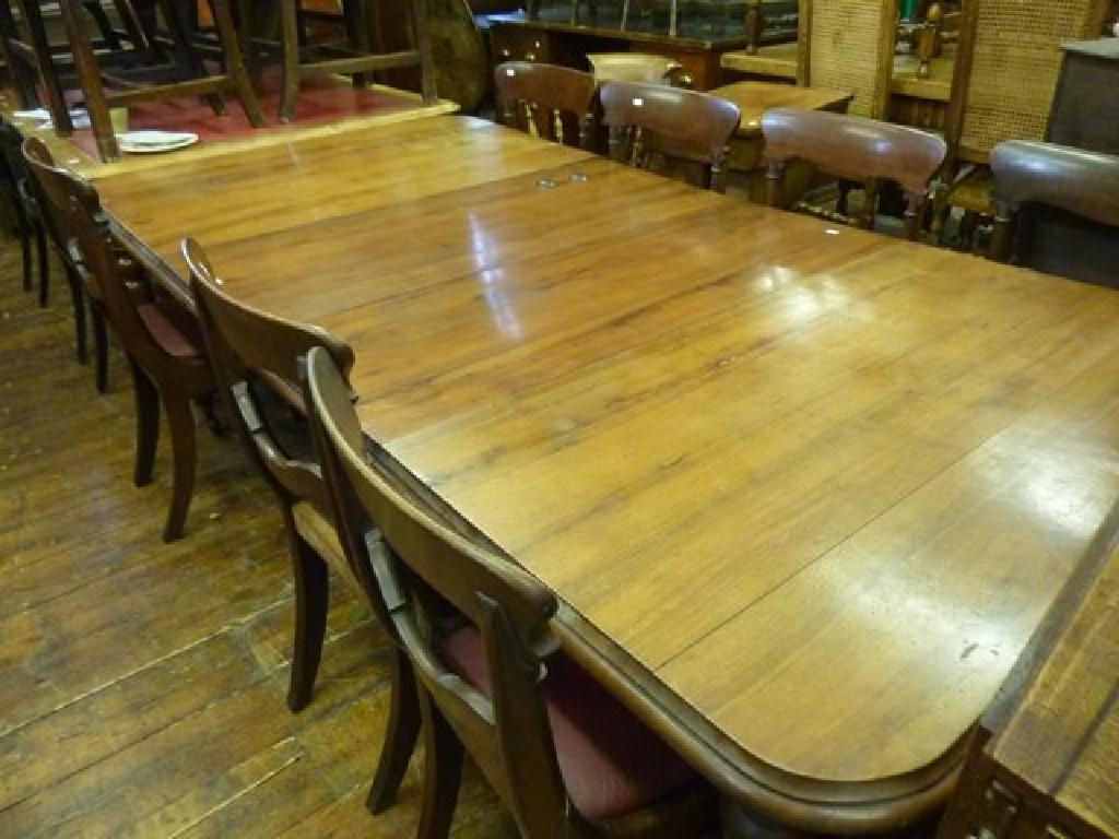 Appraisal: A Victorian walnut wind-out extending dining table of rectangular form