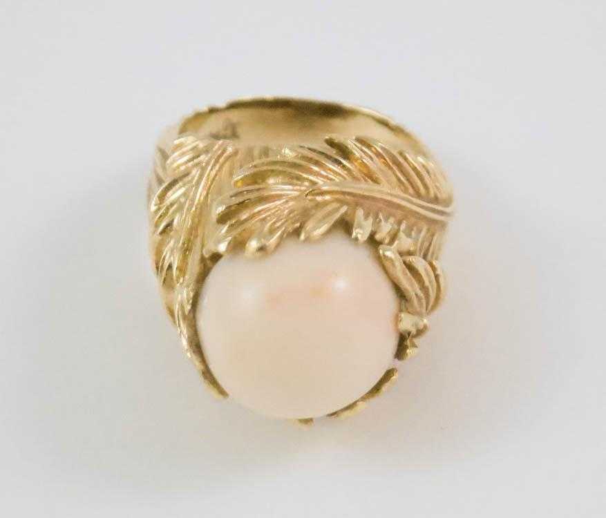 Appraisal: PINK CORAL AND FOURTEEN KARAT GOLD RING set with a