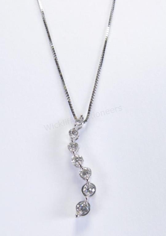 Appraisal: A K white gold journey pendant with ct of diamonds