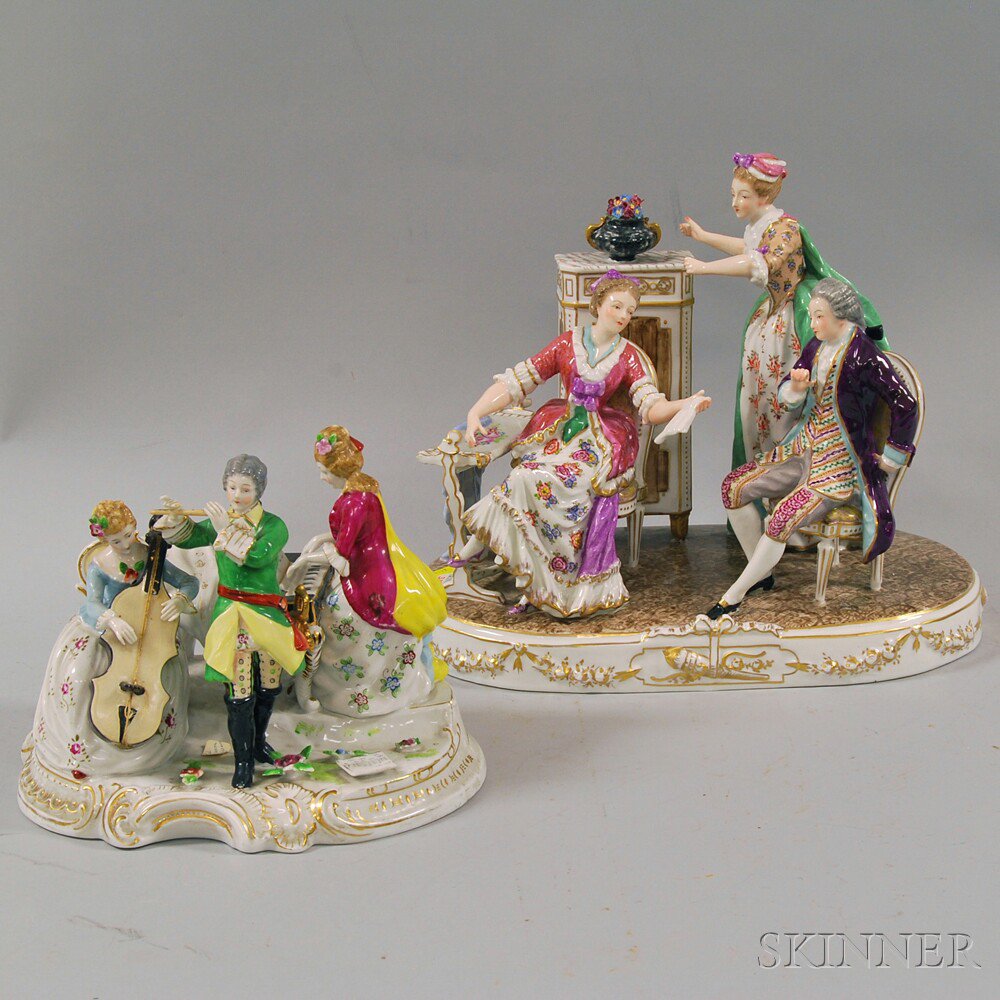 Appraisal: Two German Porcelain Figural Groups a smaller musical group with