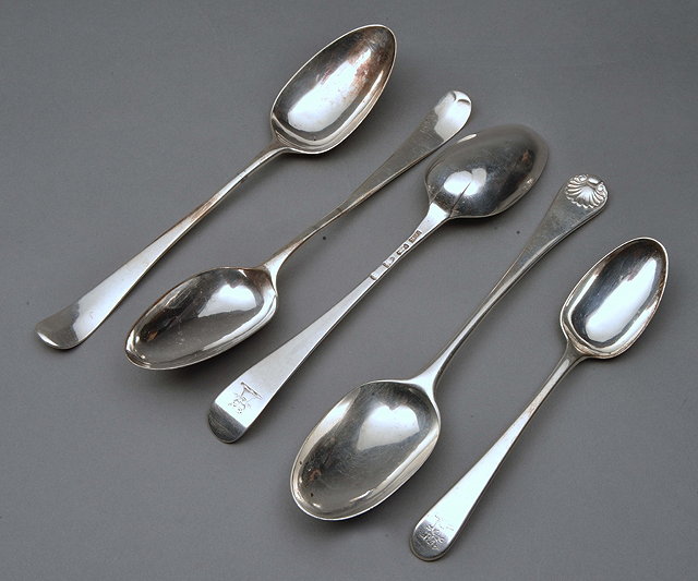 Appraisal: THREE GEORGIAN HANOVARIAN PATTERN SILVER TABLESPOON possibly by William Fearn