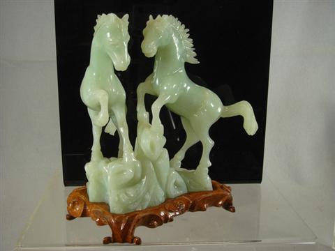 Appraisal: Green jade rearing horse group th th c x Estimate