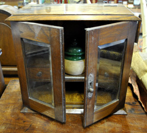 Appraisal: A Victorian oak smoker's cabinet with hinged top and twin