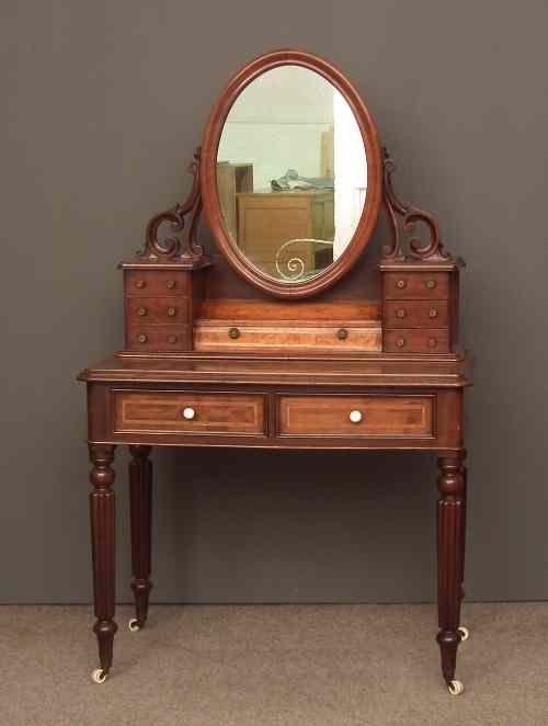 Appraisal: A Victorian mahogany Duchess pattern dressing table the superstructure with