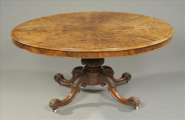 Appraisal: A Victorian burr walnut oval dining or centre table circa