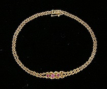 Appraisal: A Ladies' Three Ruby and Gold Bracelet k yellow gold