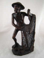 Appraisal: A Chinese rosewood carving of a fisherman drawing his net