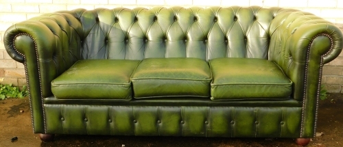 Appraisal: A thC green leather three seater Chesterfield Sofa with button