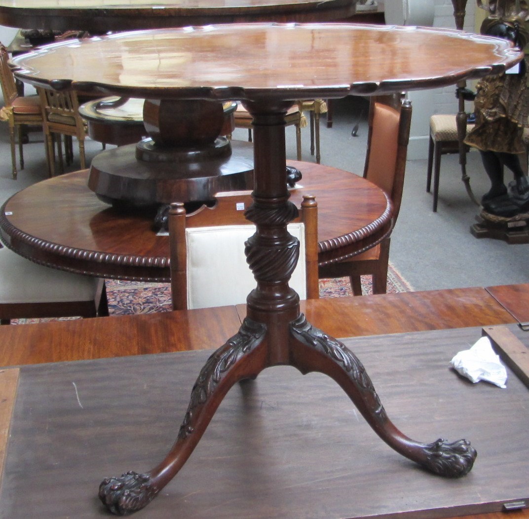 Appraisal: A George III mahogany occasional table the pie-crust snap top