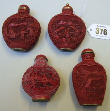 Appraisal: A group of four cinnabar lacquer snuff bottles each carved