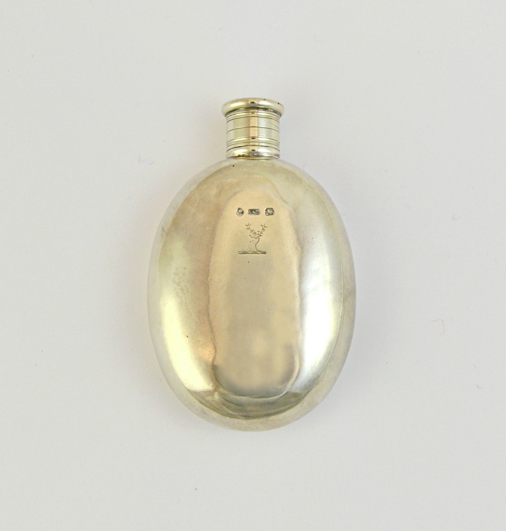 Appraisal: A Victorian silver spirit flask of oval form crest engraved