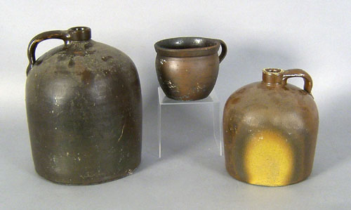 Appraisal: Two redware jugs together with a mush mug th c