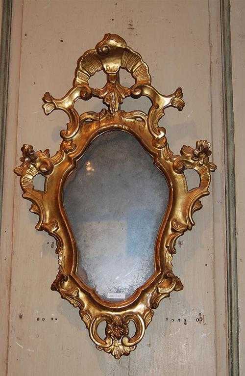 Appraisal: SMALL CARVED GILTWOOD CARTOUCHE-SHAPED MIRROR Louis XV Venice th century