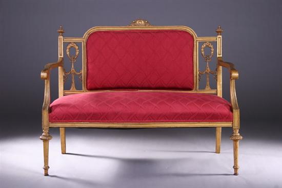 Appraisal: FRENCH LOUIS XVI-STYLE GILT-WOOD CANAPE early th century Crested padded