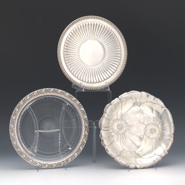 Appraisal: THREE STERLING SILVER SERVING PLATES One glass dish with sterling