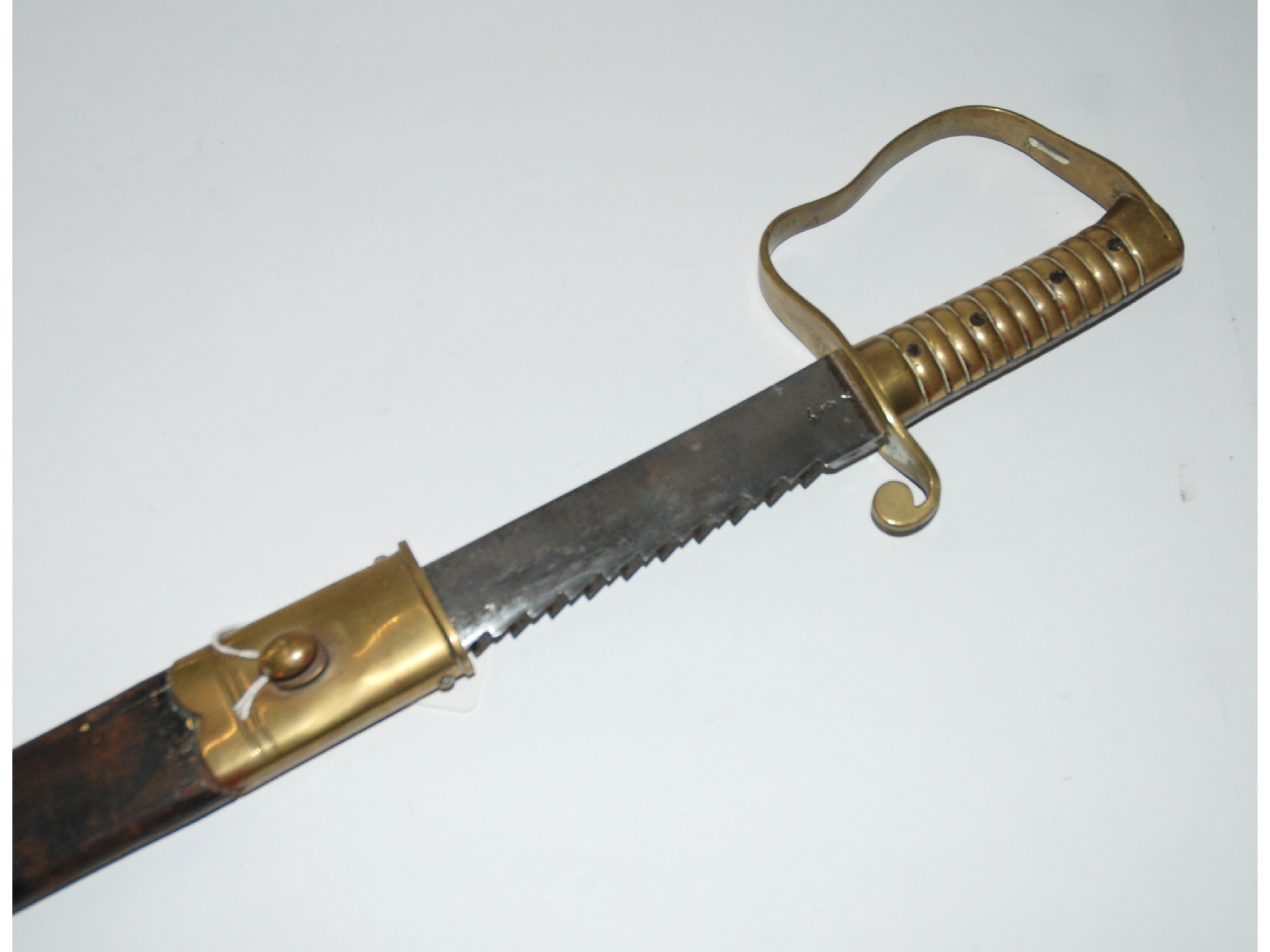 Appraisal: A Pioneer regiment sword in leather and brass scabbard