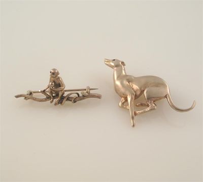 Appraisal: A ct gold greyhound brooch by Harriet Glen with sapphire