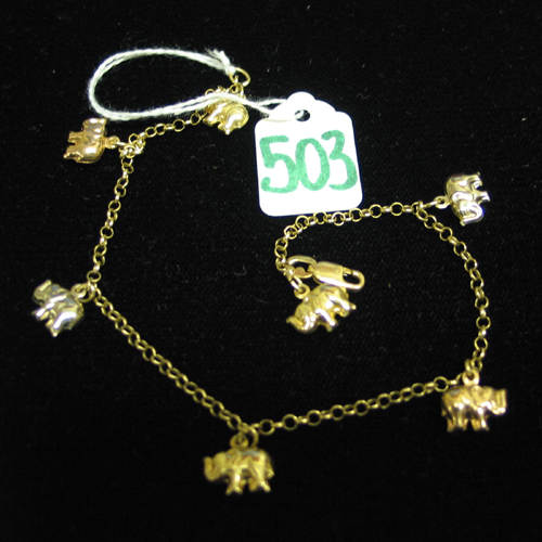 Appraisal: FOURTEEN KARAT YELLOW WHITE AND ROSE GOLD CHARM BRACELET The