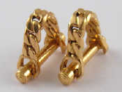 Appraisal: A pair of French hallmarked carat gold stirrup cufflinks bars