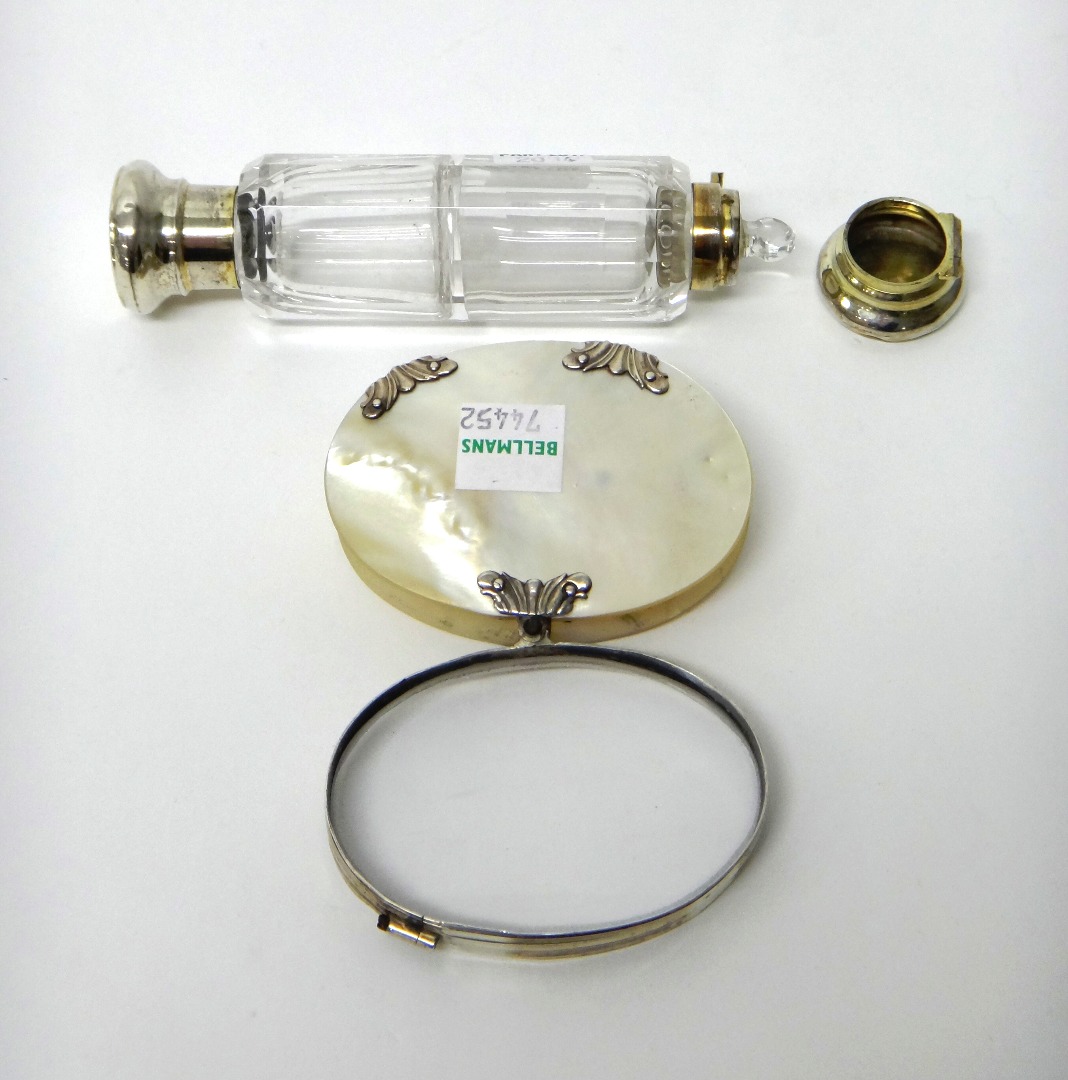 Appraisal: A silver mounted and mother of pearl oval folding magnifying