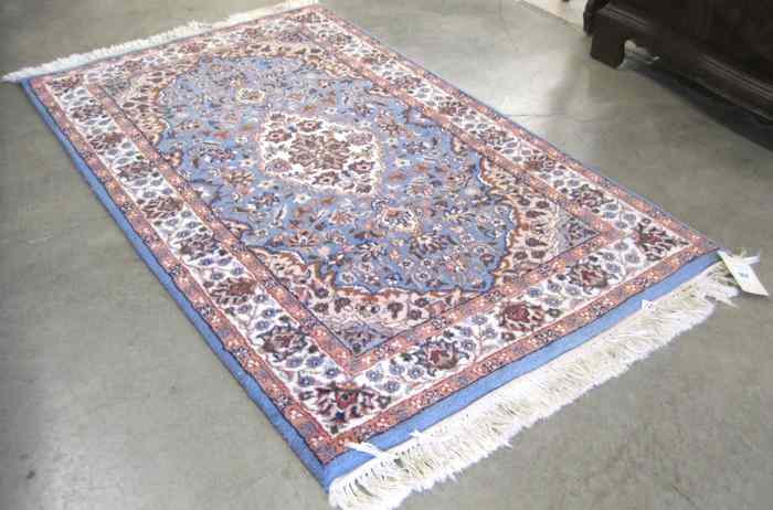 Appraisal: HAND KNOTTED ORIENTAL AREA RUG Indo-Persian floral and central floral