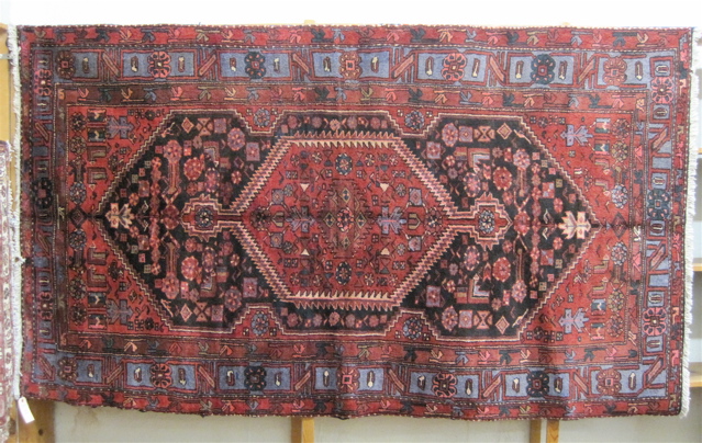 Appraisal: PERSIAN TRIBAL AREA RUG Hamadan Province northwestern Iran geometric medallion