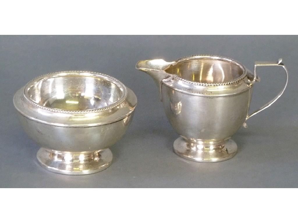 Appraisal: EARLY TWENTIETH CENTURY SILVER BACHELOR CREAM JUG AND MATCHING SUGAR