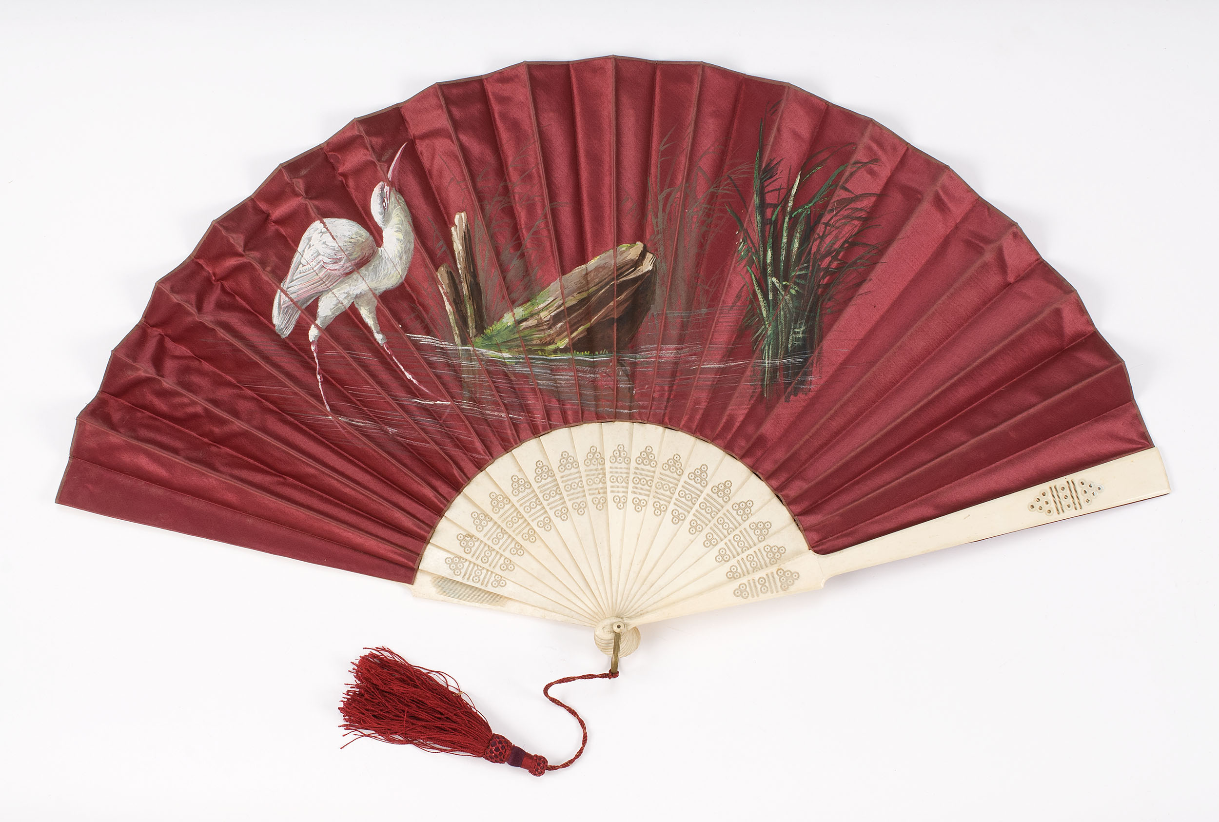 Appraisal: RED SATIN AND BONE FOLDING FAN Circa Red satin leaf