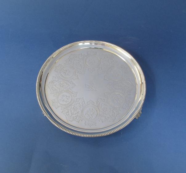 Appraisal: A VICTORIAN SALVER of circular form with a raised beaded