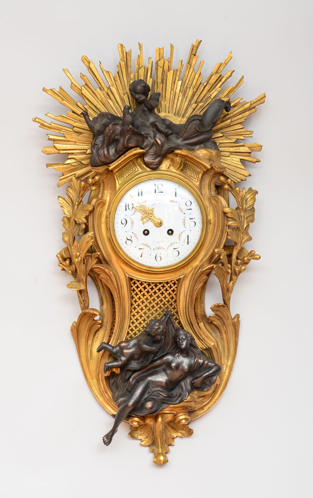 Appraisal: LOUIS XV STYLE GILT-METAL AND BRONZE CARTEL CLOCK The enameled