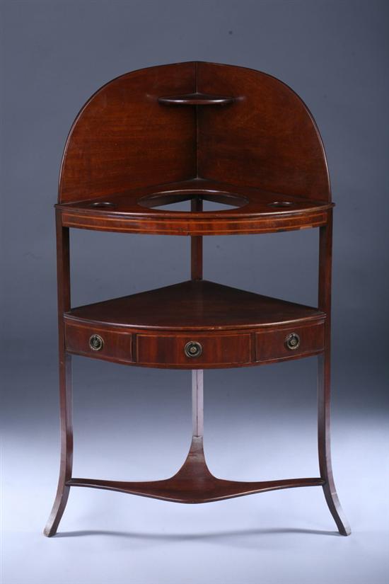 Appraisal: REGENCY MAHOGANY CORNER WASH STAND early th century Rounded-corner back-splash