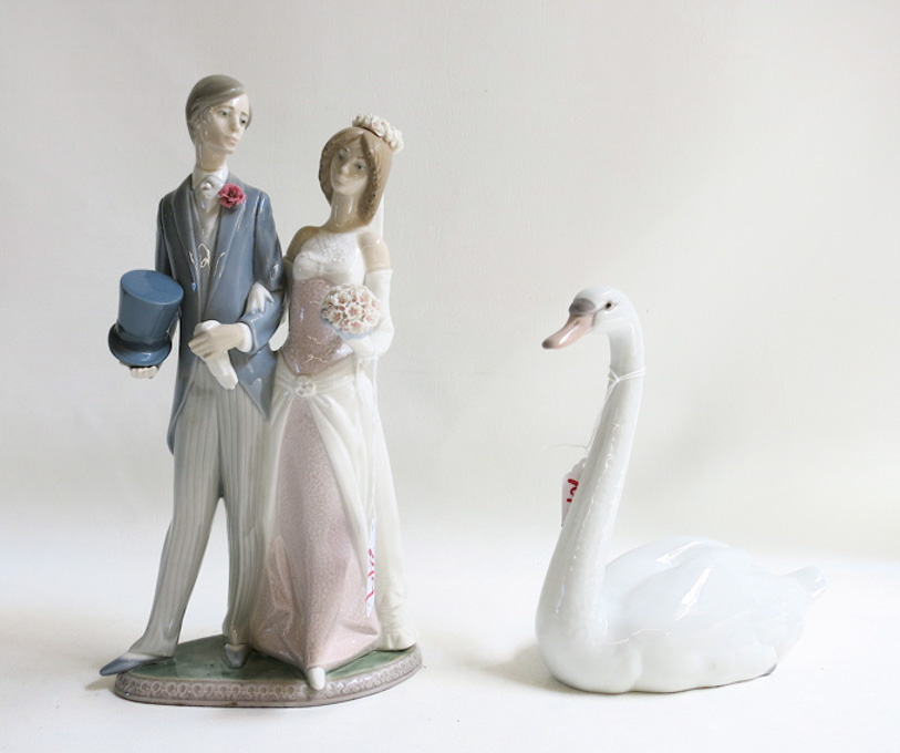 Appraisal: TWO LLADRO PORCELAIN FIGURINES Wedding sculptor Juan Huerta issued retired