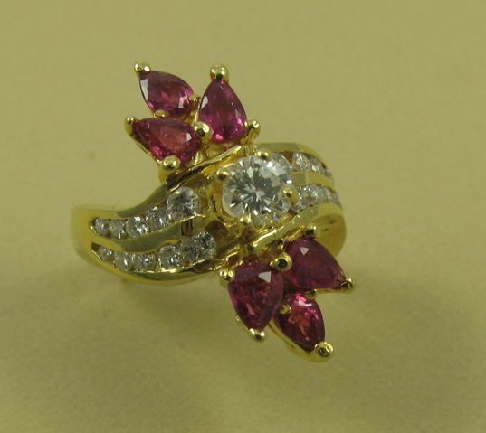 Appraisal: RUBY AND DIAMOND RING k yellow gold and centering a