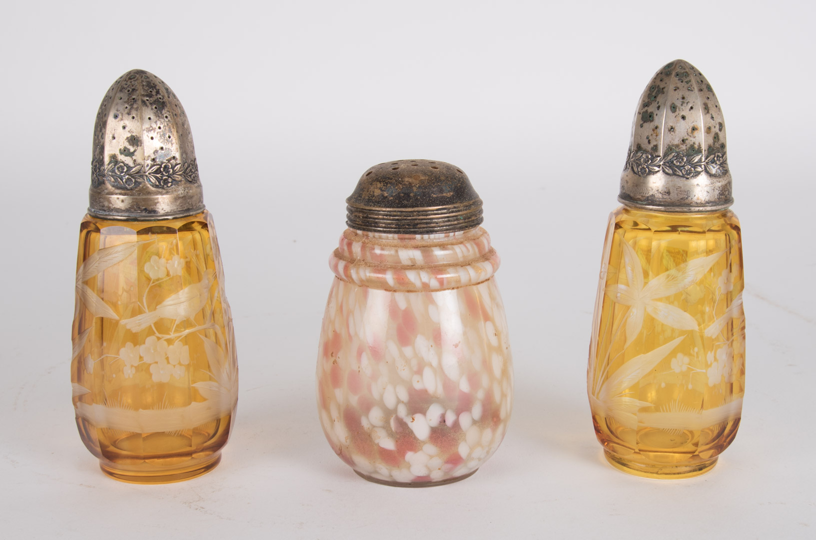 Appraisal: Two etched glass and one spot glass shakers