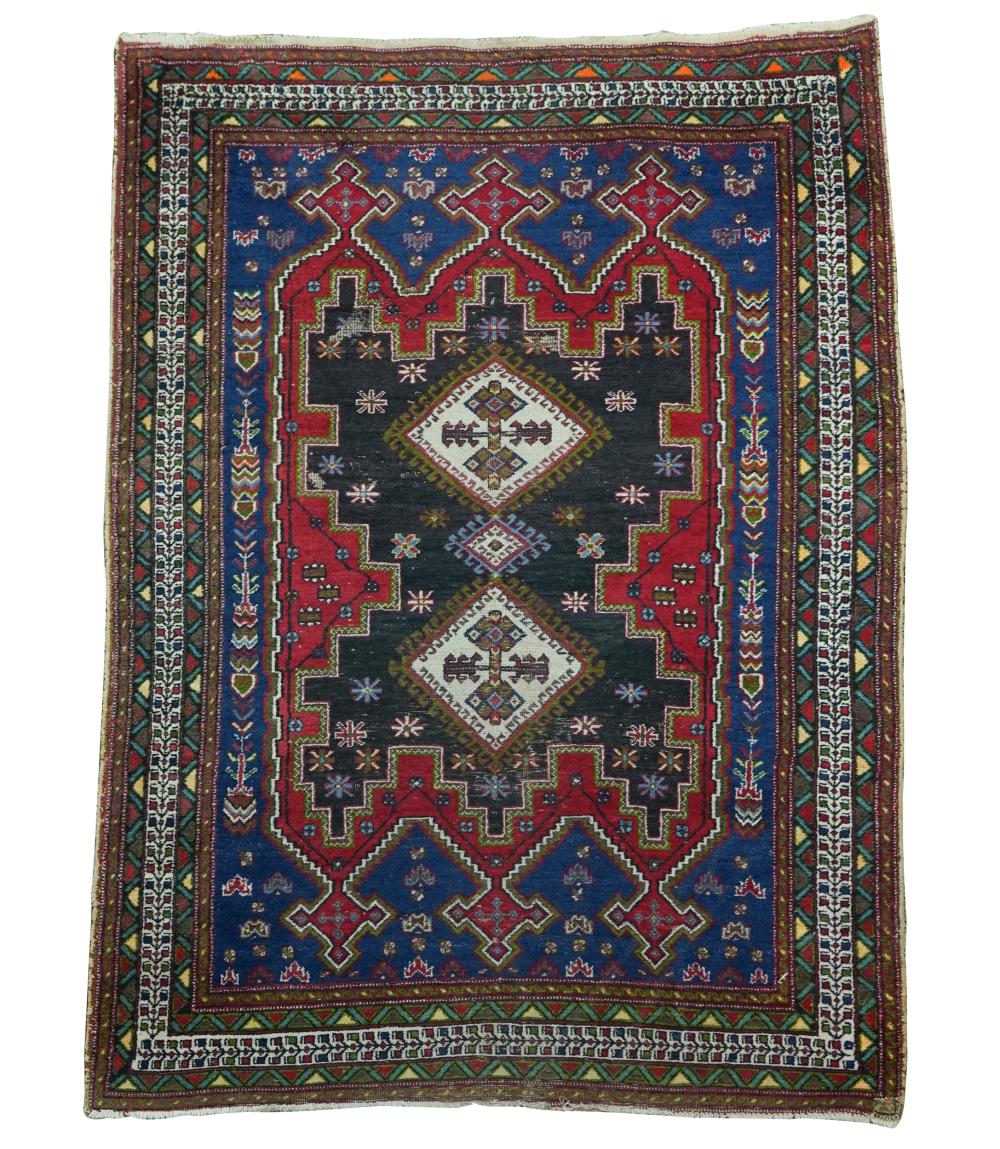 Appraisal: BLUE FIELD PERSIAN CARPETwool Condition needs cleaning reduced fringe shows