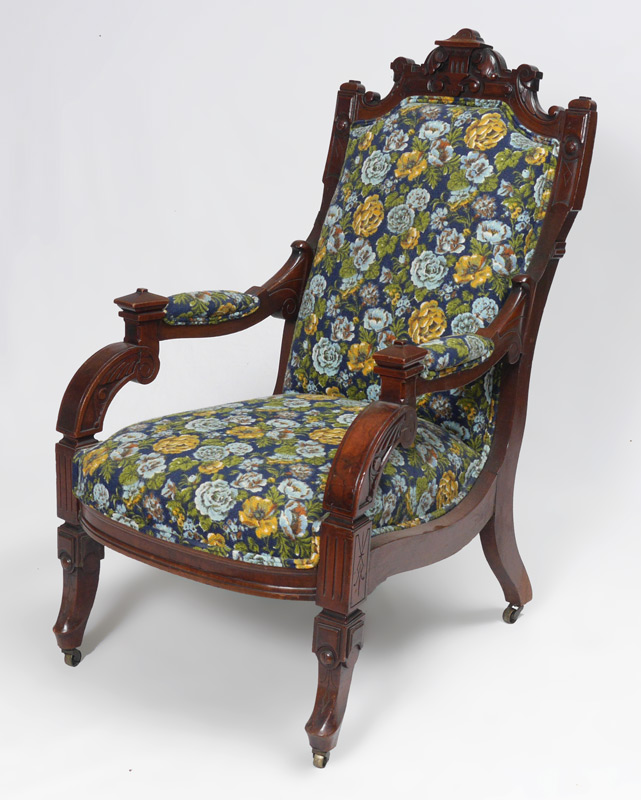 Appraisal: CARVED HIGH VICTORIAN ARM CHAIR Carved all over in the