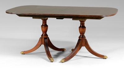 Appraisal: Mahogany dining table each pedestal with urn-turned support and tripod