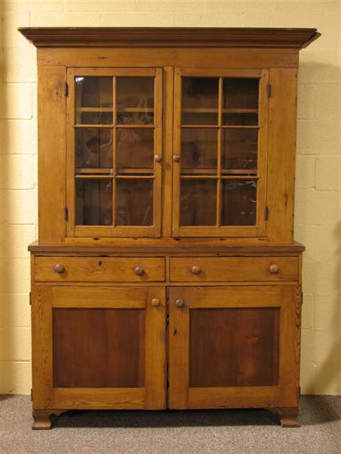 Appraisal: AMERICAN PINE STEPBACK CUPBOARD Eighteenth century the molded cornice over