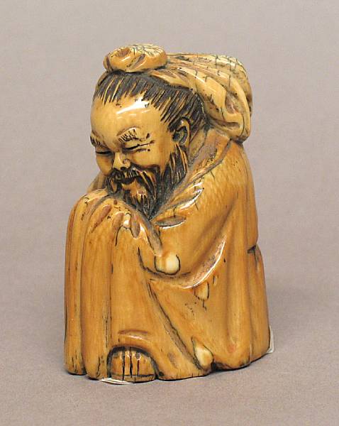 Appraisal: A carved ivory figure of a scholar Seen in a