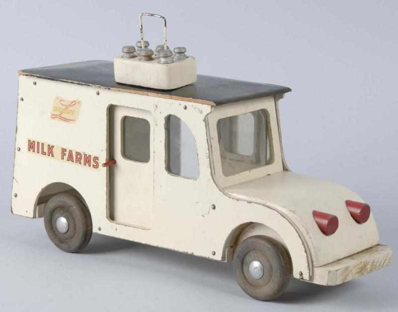 Appraisal: Wooden Buddy L Milk Farms Truck Toy Description American Circa