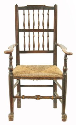 Appraisal: An early th century ash spindle back open armchair with