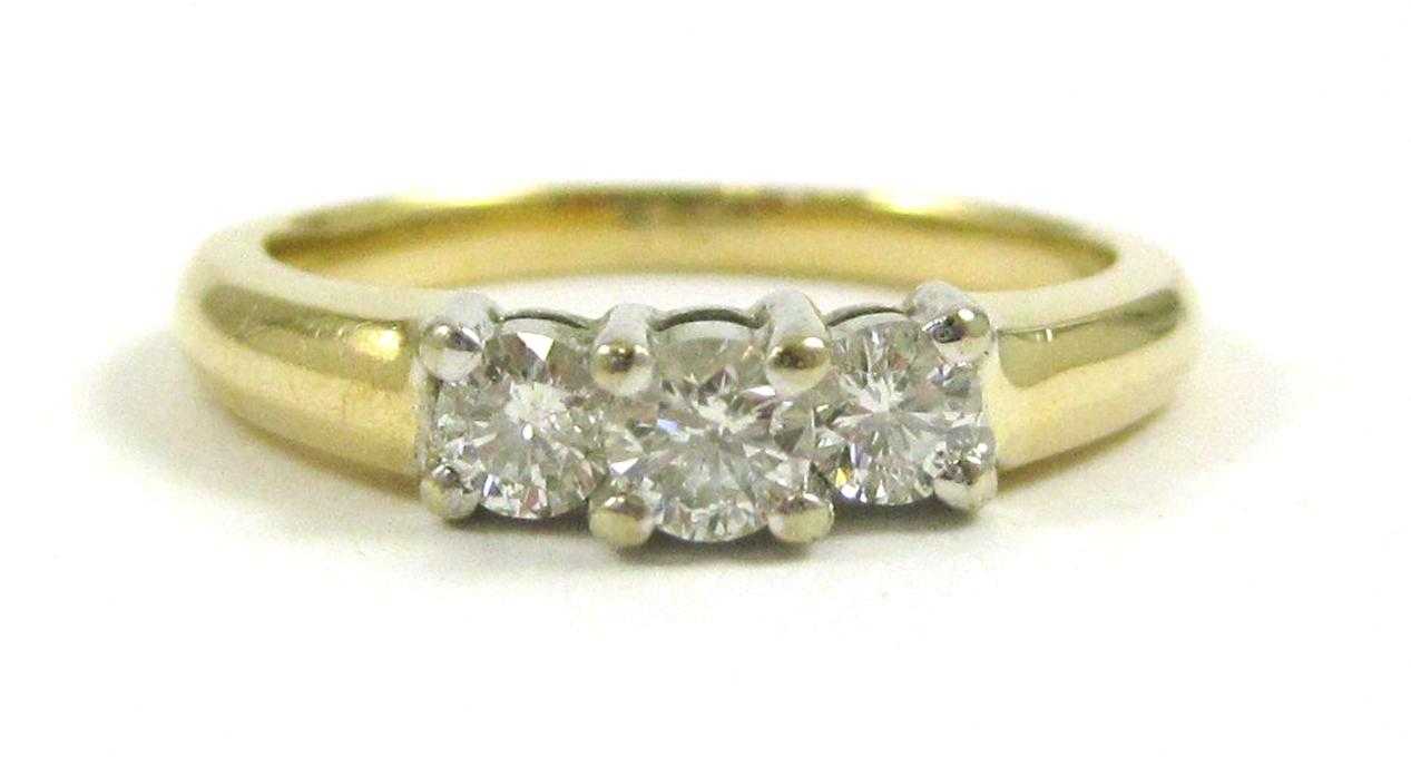 Appraisal: THREE-STONE DIAMOND AND FOURTEEN KARAT GOLD RING set with three